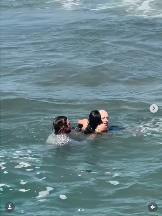 Luas Taub rescuing Chris and Coco Greene from rip current in Oceanside, CA