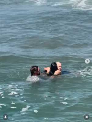 Luas Taub rescuing Chris and Coco Greene from rip current in Oceanside, CA
